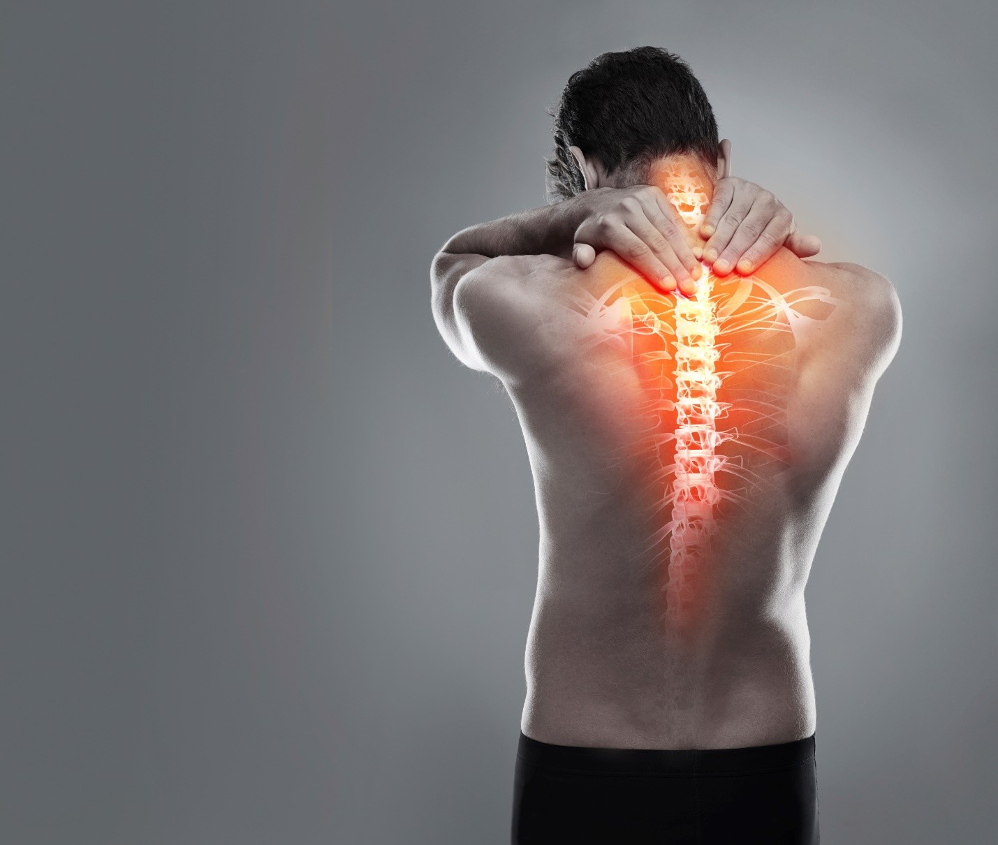 Man holding his neck with a spine and shoulder overlay highlighted in red